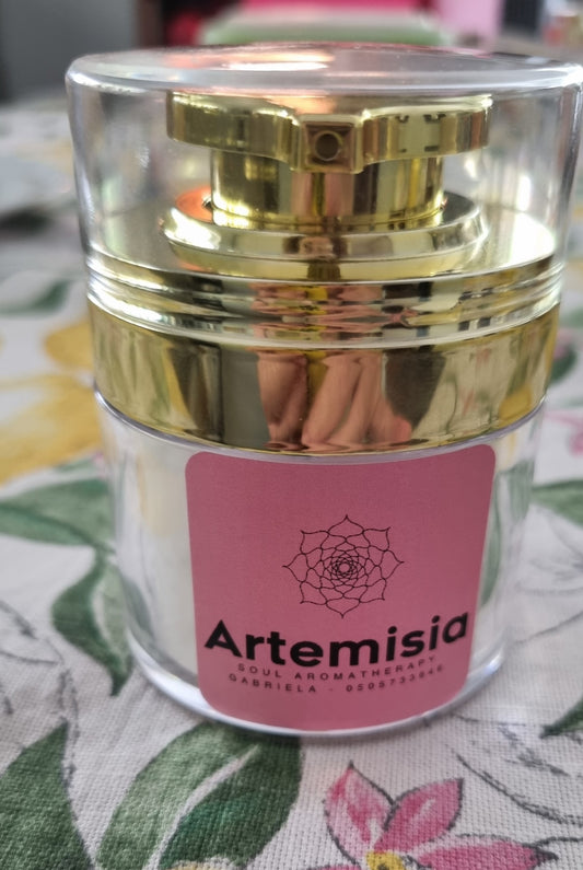 After Sun - Relief Lotion Cosmetic jar with gold lid and pink label featuring 'Artemisia' brand on a floral fabric background.