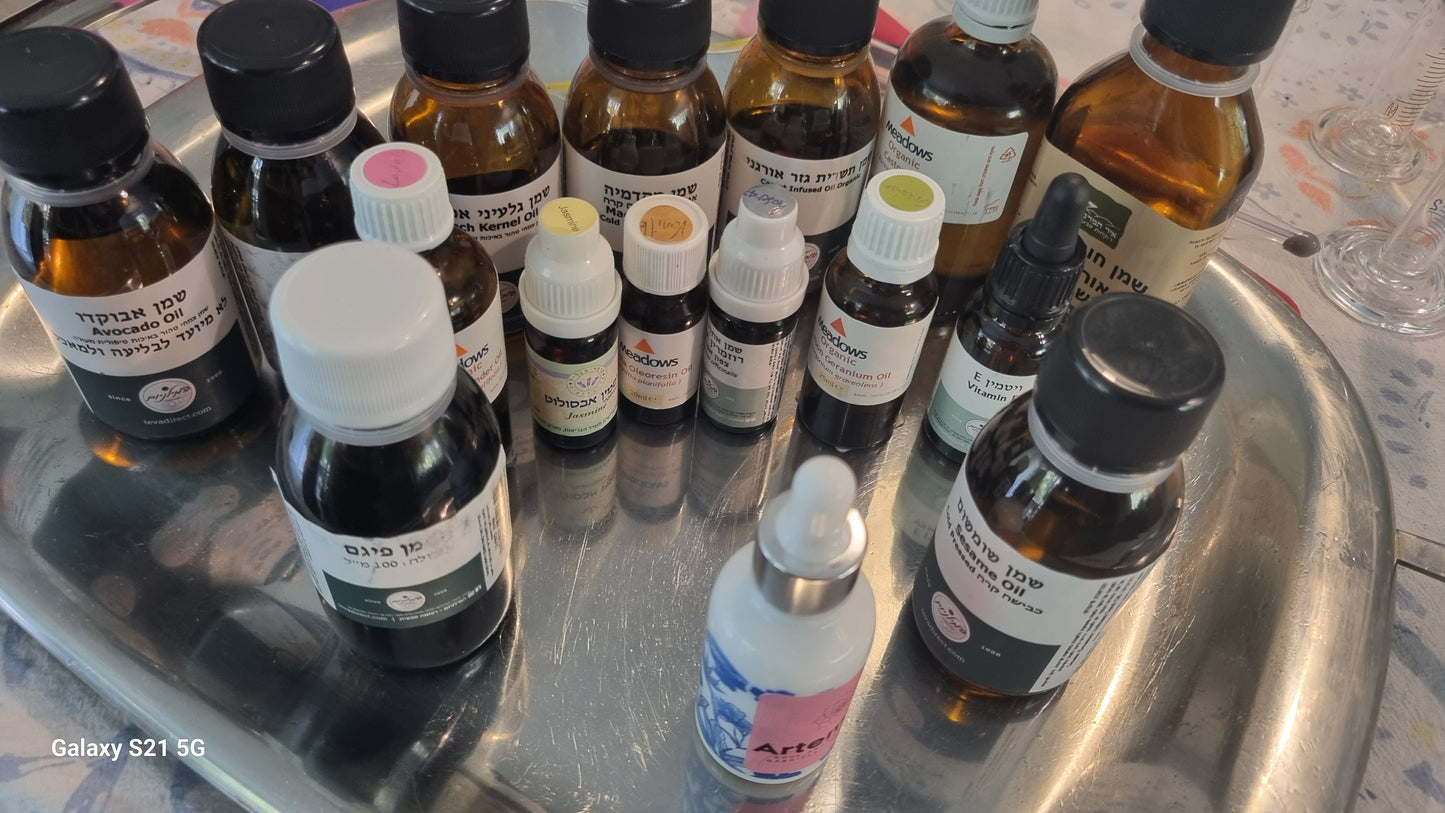 Collection of small bottles with various labels on a metallic tray.