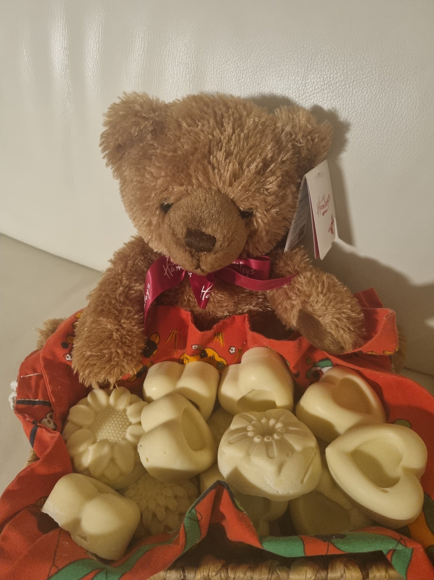 A teddy bear with Soaps Red