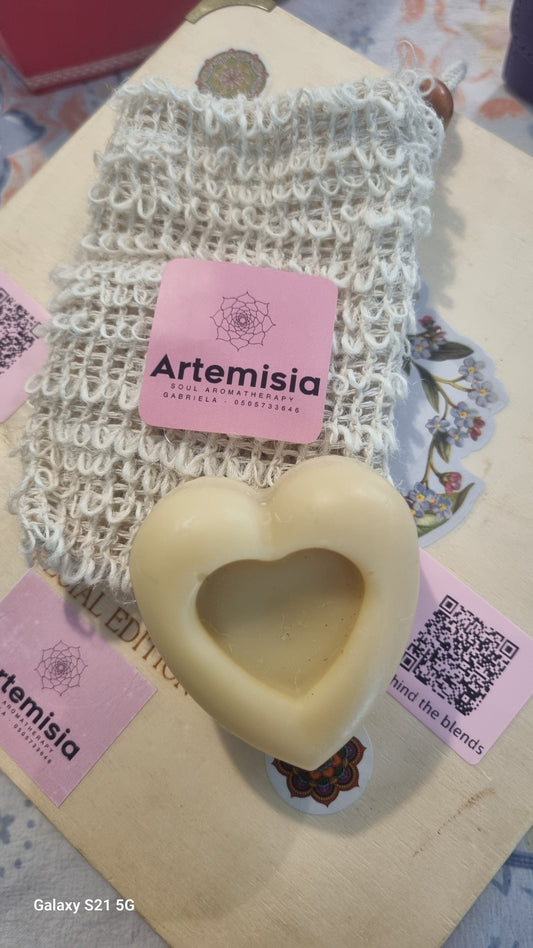 Heart-shaped soap on a textured surface with Artemisia branding
