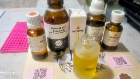 Collection of Meadwell oil bottles on a table with a pink mat and white box.
